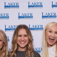 Three girls smiling at camera
